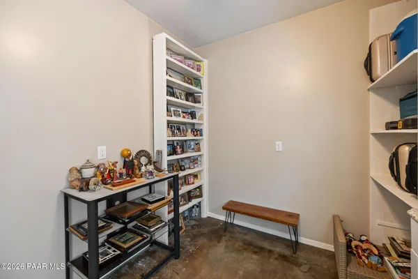 an aerial view of a house with a mountain