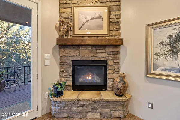 a bedroom with bed and a chandelier