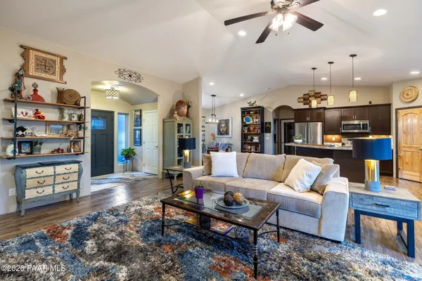 a bathroom with a granite countertop sink and a bathtub