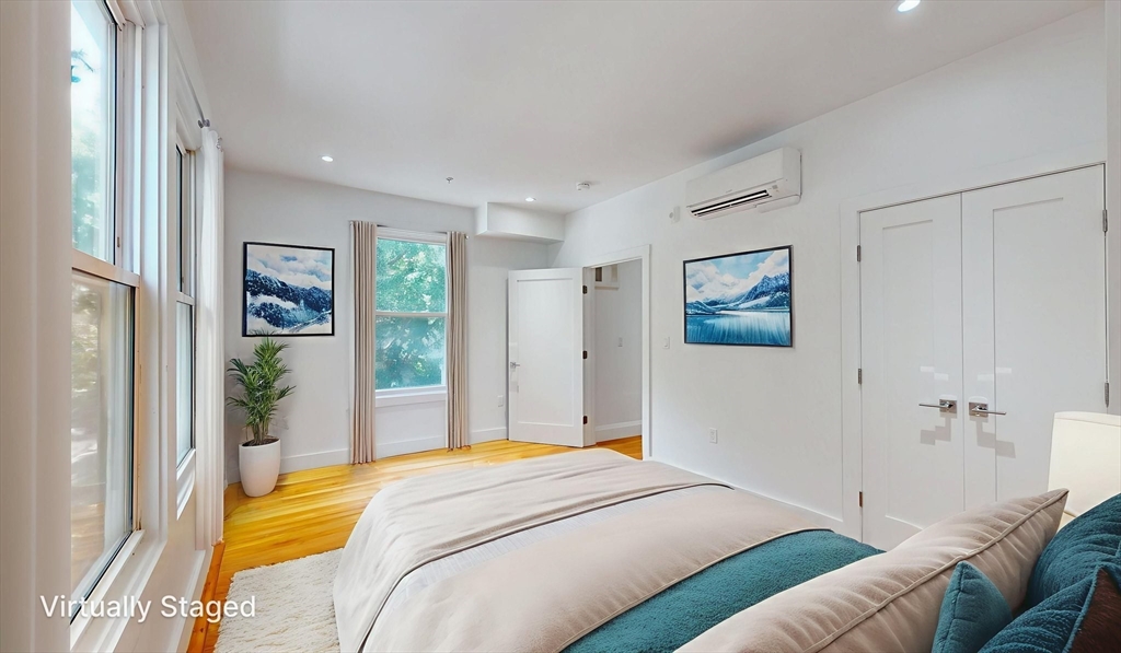 21 Regent Circle, Unit 3 Brookline, MA 02445 - Photo 11 of 21 a bedroom with a bed and a couch