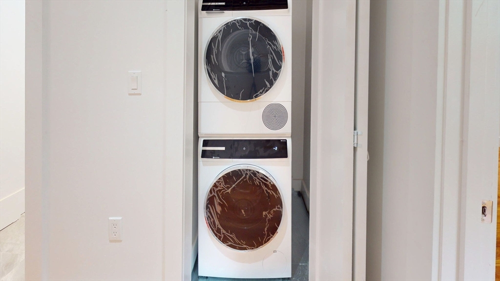 21 Regent Circle, Unit 3 Brookline, MA 02445 - Photo 18 of 21 a utility room with dryer and washer