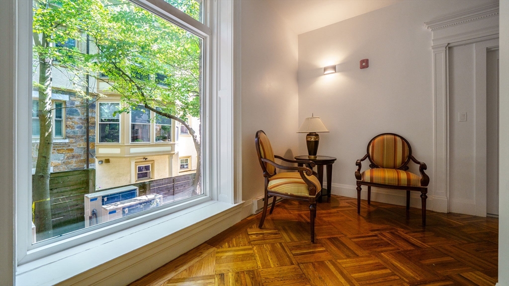 21 Regent Circle, Unit 3 Brookline, MA 02445 - Photo 2 of 21 a room with chairs and a rug