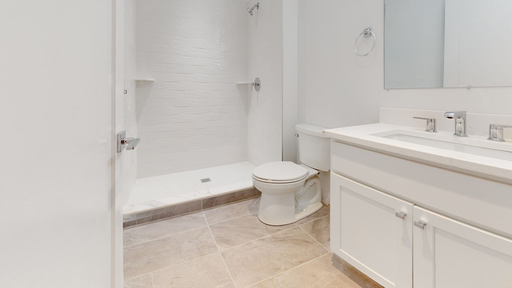 21 Regent Circle, Unit 3 Brookline, MA 02445 - Photo 10 of 21 a spacious bathroom with a sink toilet and shower