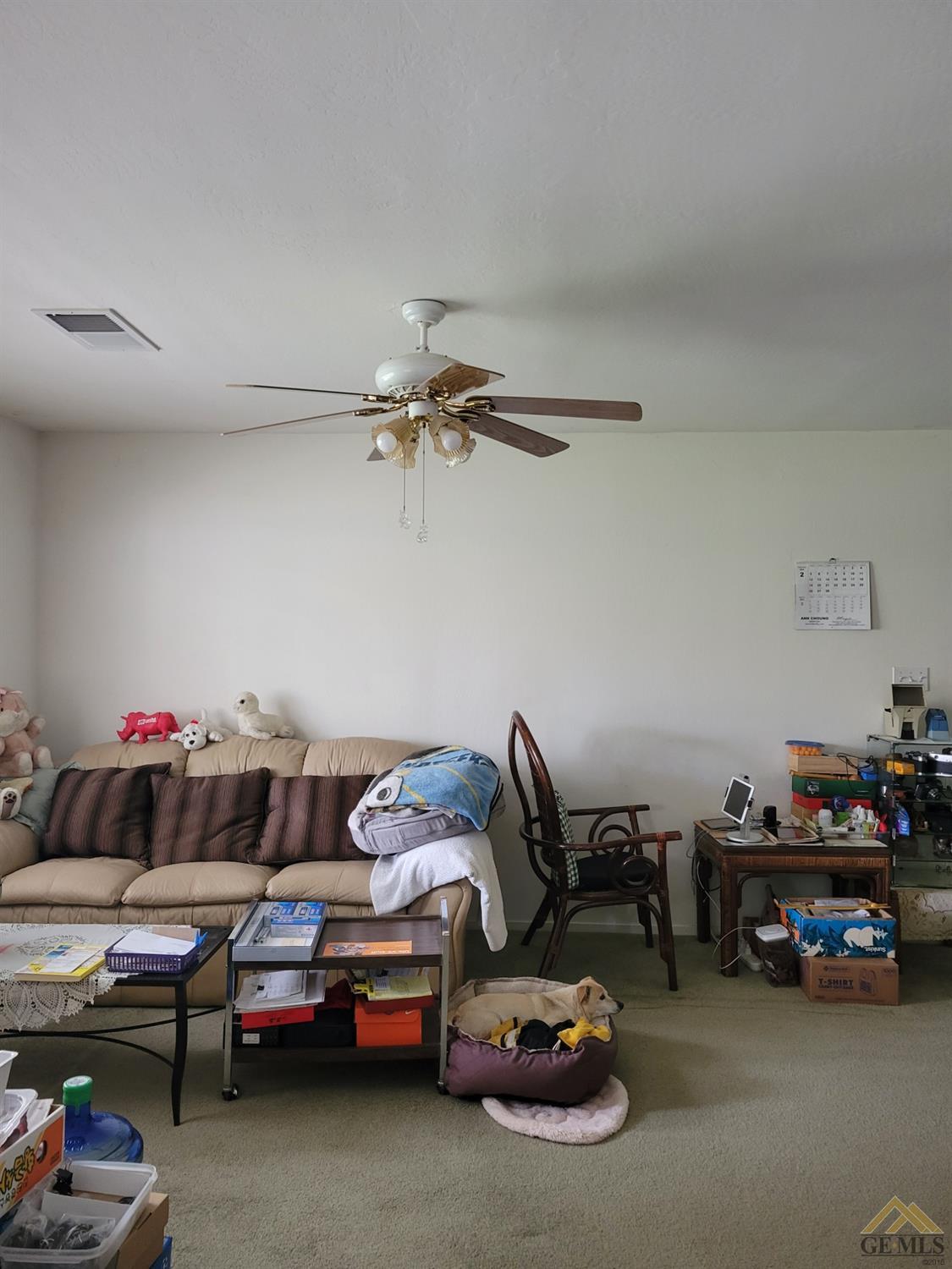 Undisclosed Address Bakersfield, CA 93311 - Photo 3 of 9 a living room with a couch