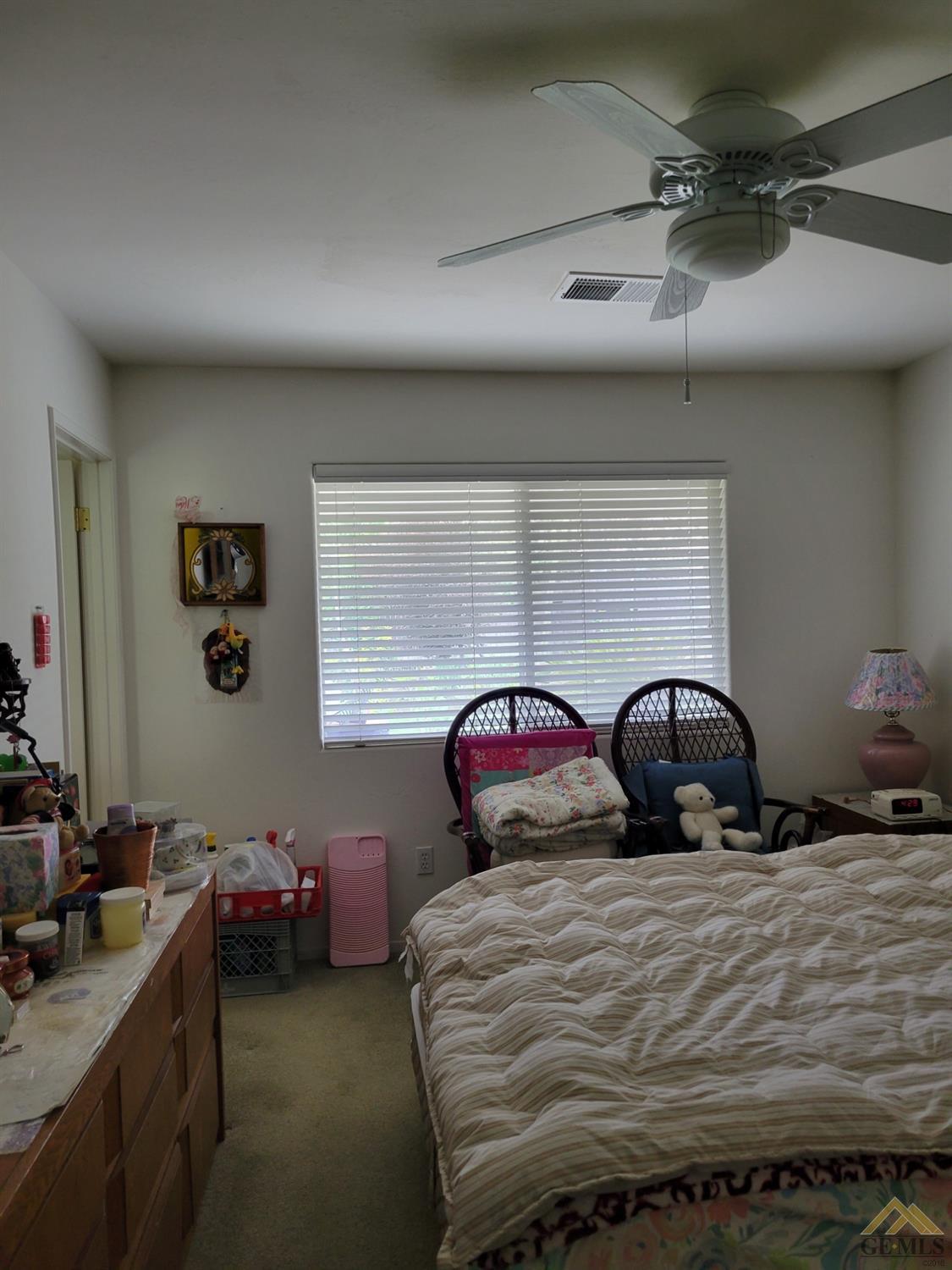 Undisclosed Address Bakersfield, CA 93311 - Photo 6 of 9 a bedroom with a bed and window