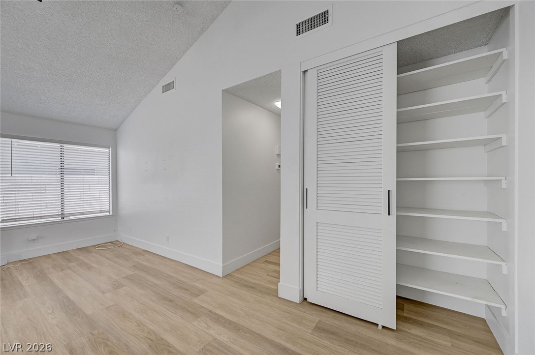 4840 Summerhill Road Las Vegas, NV 89121 - Photo 21 of 56 A well-lit area featuring ample storage with built-in shelving, complemented by wide windows.