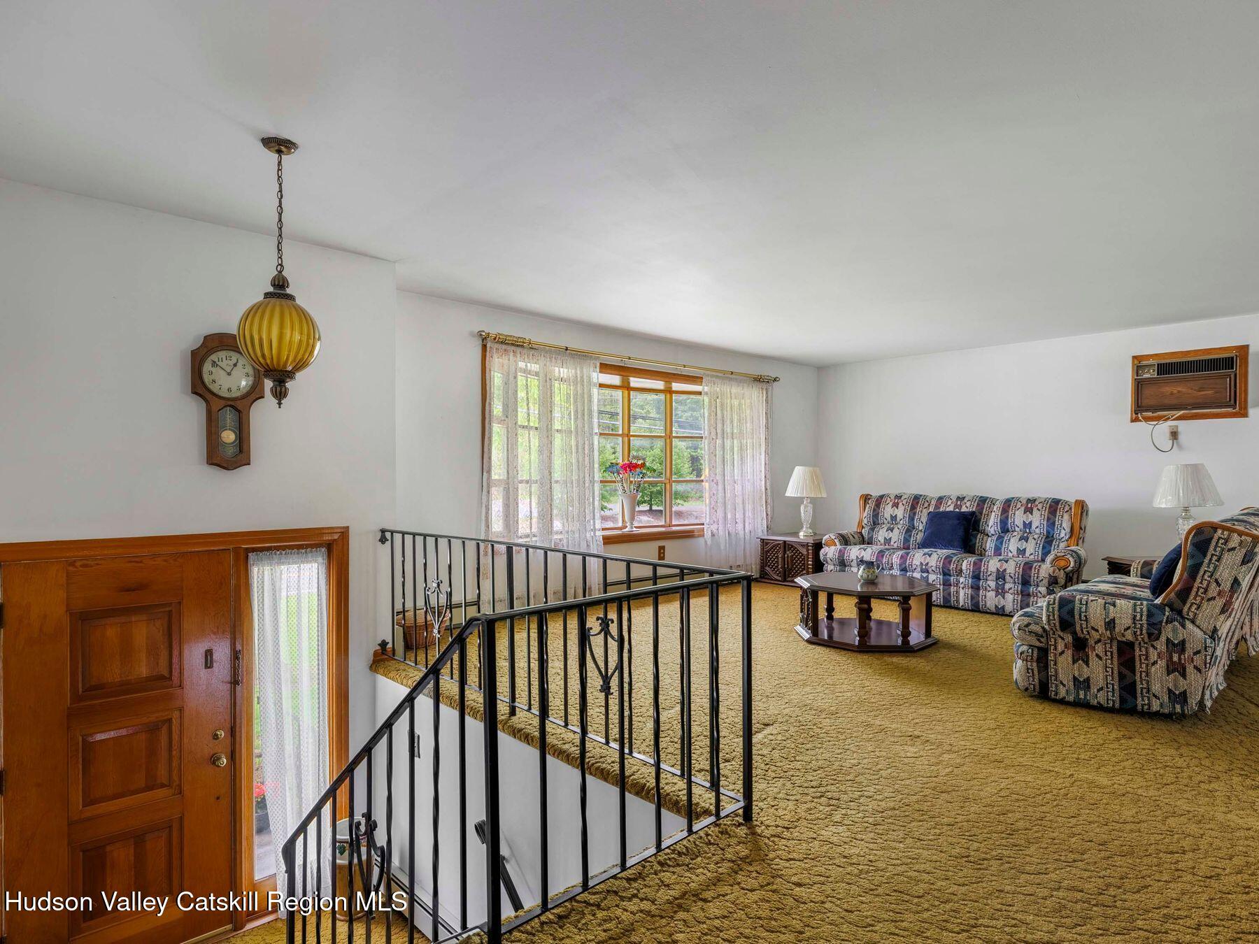 104 New Paltz Road Highland, NY 12528 - Photo 10 of 43 a view of a livingroom with furniture and window