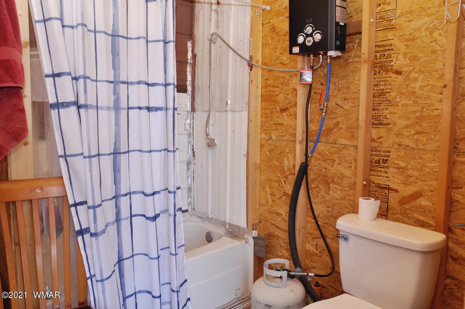 4384 Indian Bend Road Snowflake, AZ 85937 - Photo 8 of 19 a bathroom with a toilet and shower
