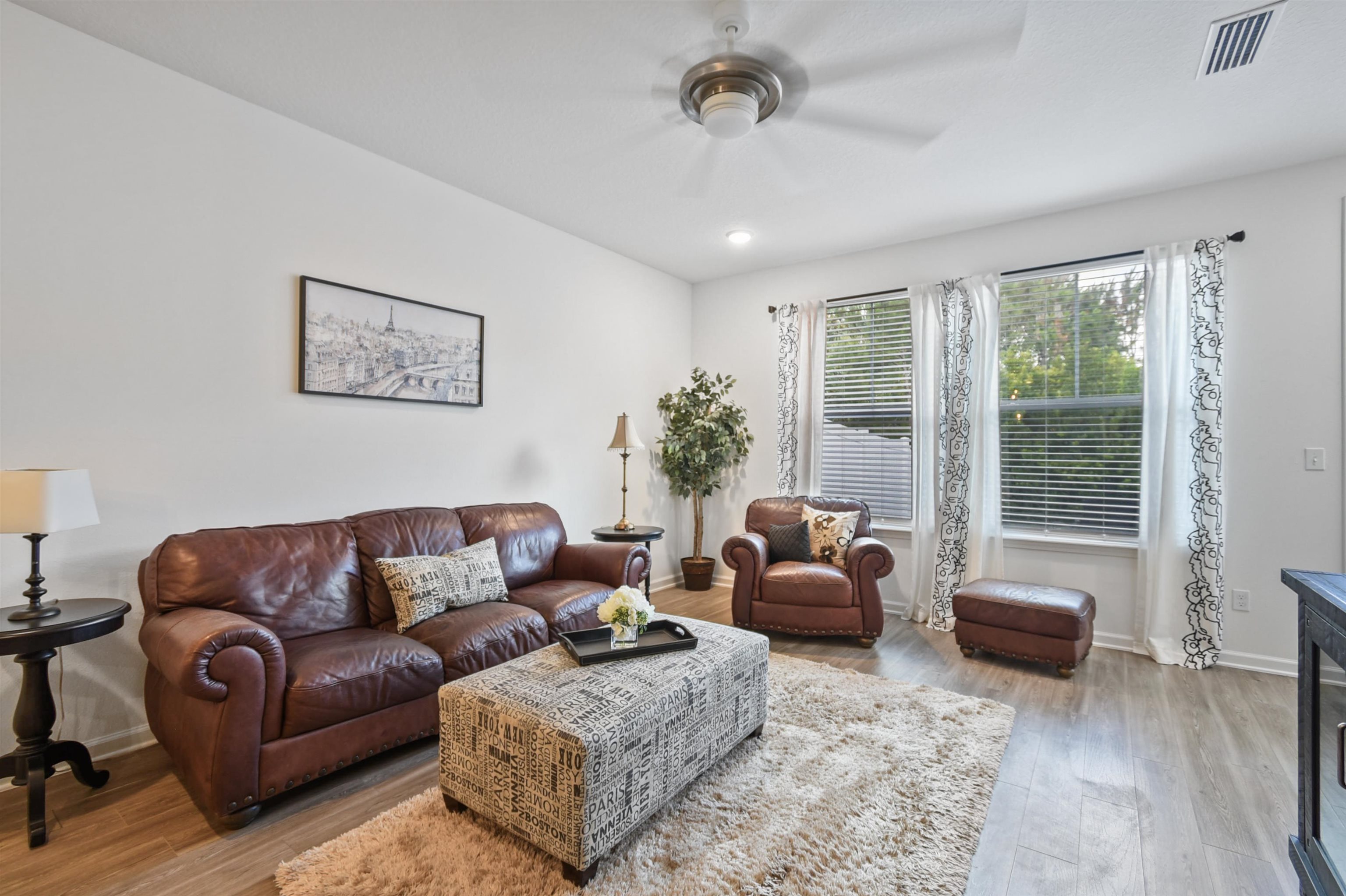 105 Ridge Lake Road St. Augustine, FL 32086 - Photo 12 of 34 a living room with furniture and a large window