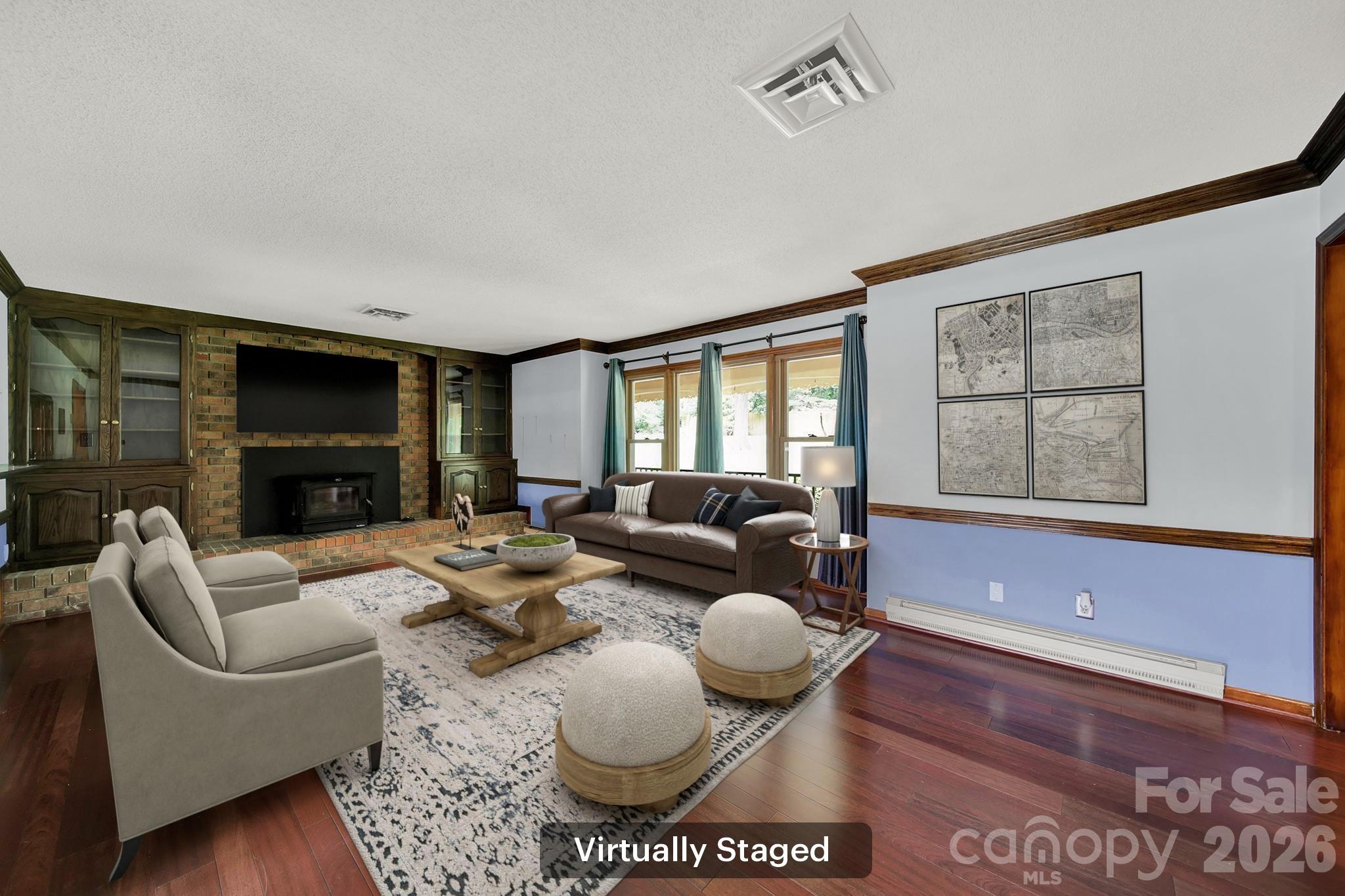 5913 Tom Query Road Charlotte, NC 28213 - Photo 4 of 47 a living room with furniture a flat screen tv and a large window