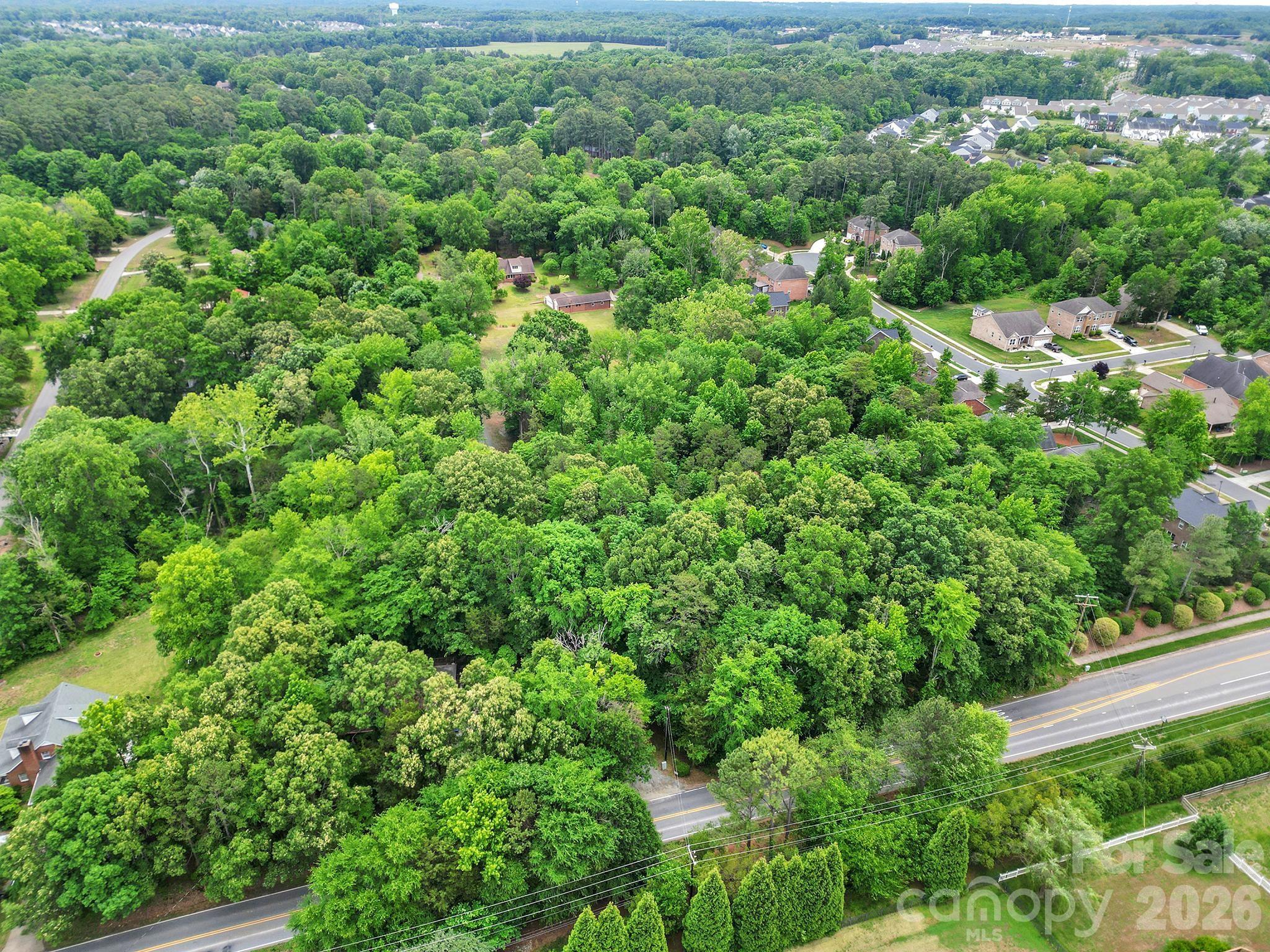 5913 Tom Query Road Charlotte, NC 28213 - Photo 45 of 47 an aerial view of residential house with outdoor space and trees all around