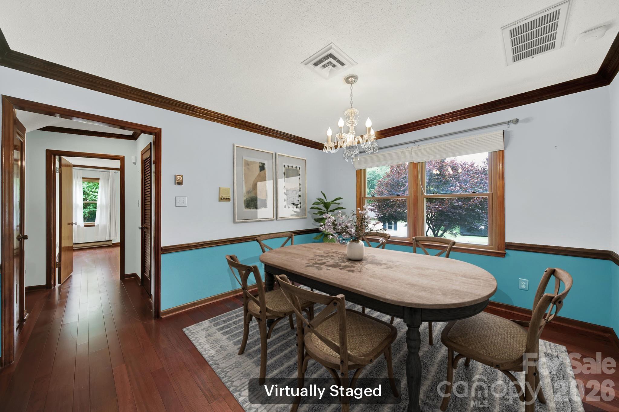 5913 Tom Query Road Charlotte, NC 28213 - Photo 7 of 47 a view of a dining room with furniture window and wooden floor