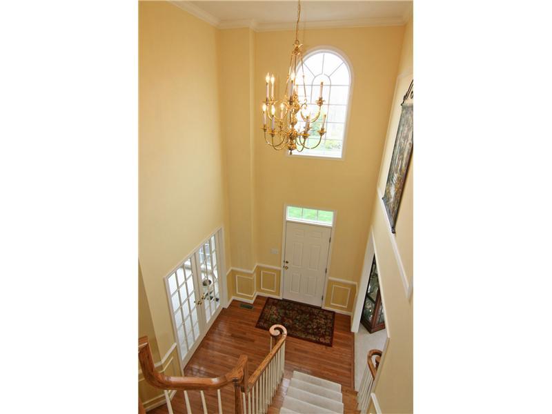 313 Buffalo Ridge Road Canonsburg, PA 15317 - Photo 15 of 25 Entry/Foyer. The two-story entry is elegantly appointed with crown molding, chair rails and wainscoting, transoms and Palladium window...