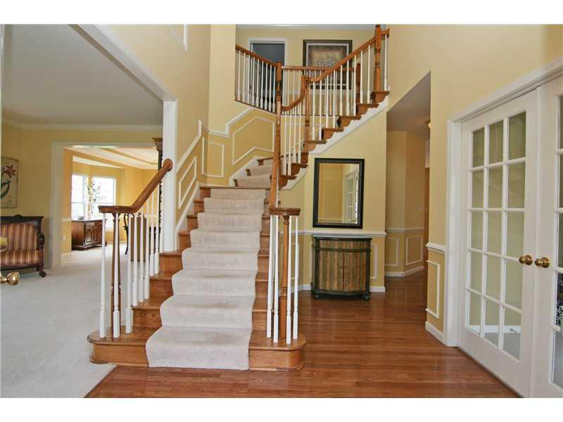 313 Buffalo Ridge Road Canonsburg, PA 15317 - Photo 3 of 25 Entry/Foyer. Setting a tone of fine taste and warmth! Two-story entry with hardwood flooring, crown molding, wainscoting and chair rail...