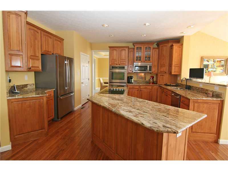 313 Buffalo Ridge Road Canonsburg, PA 15317 - Photo 8 of 25 Kitchen. Center island with a breakfast bar design...efficient work area...stainless appliances including a double oven! A generous walk-in pantry is also provided.