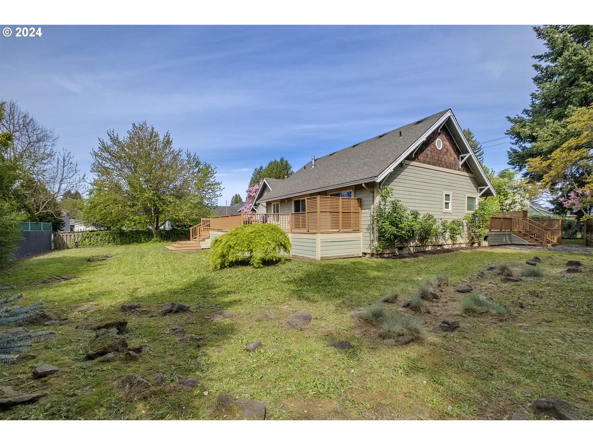 5434 Southeast King Road Milwaukie, OR 97222 - Photo 28 of 33 a house with green field in front of it