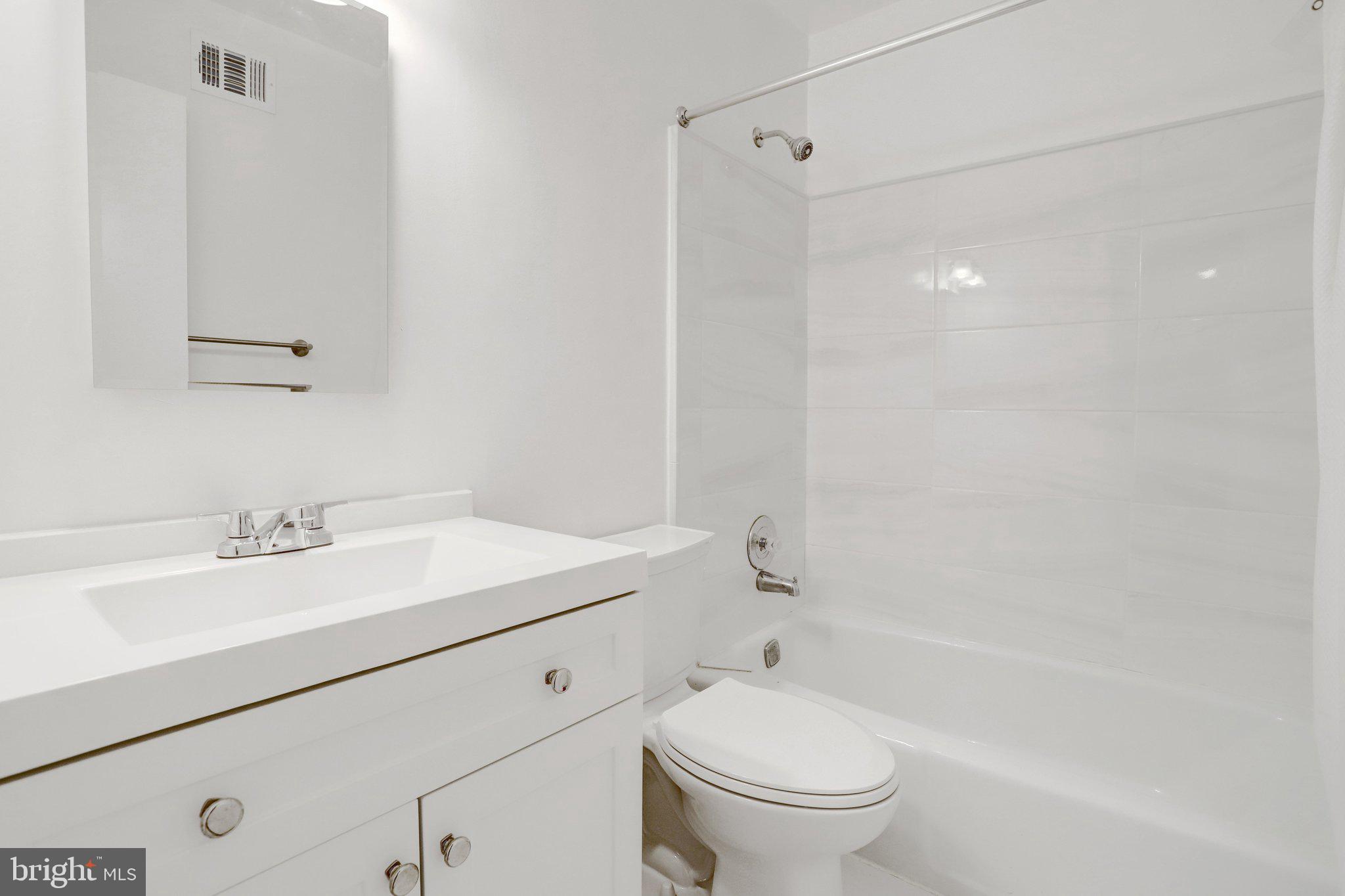 2225 North Tuckahoe Street Arlington, VA 22205 - Photo 19 of 37 a bathroom with a sink a toilet and shower