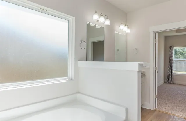 a view of a hallway with chandelier and entryway