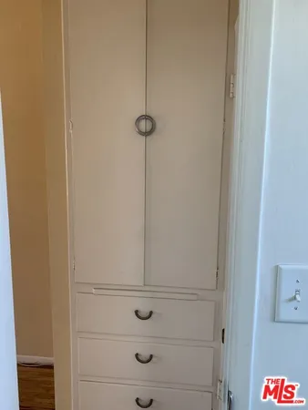 a bathroom with a sink toilet and a mirror