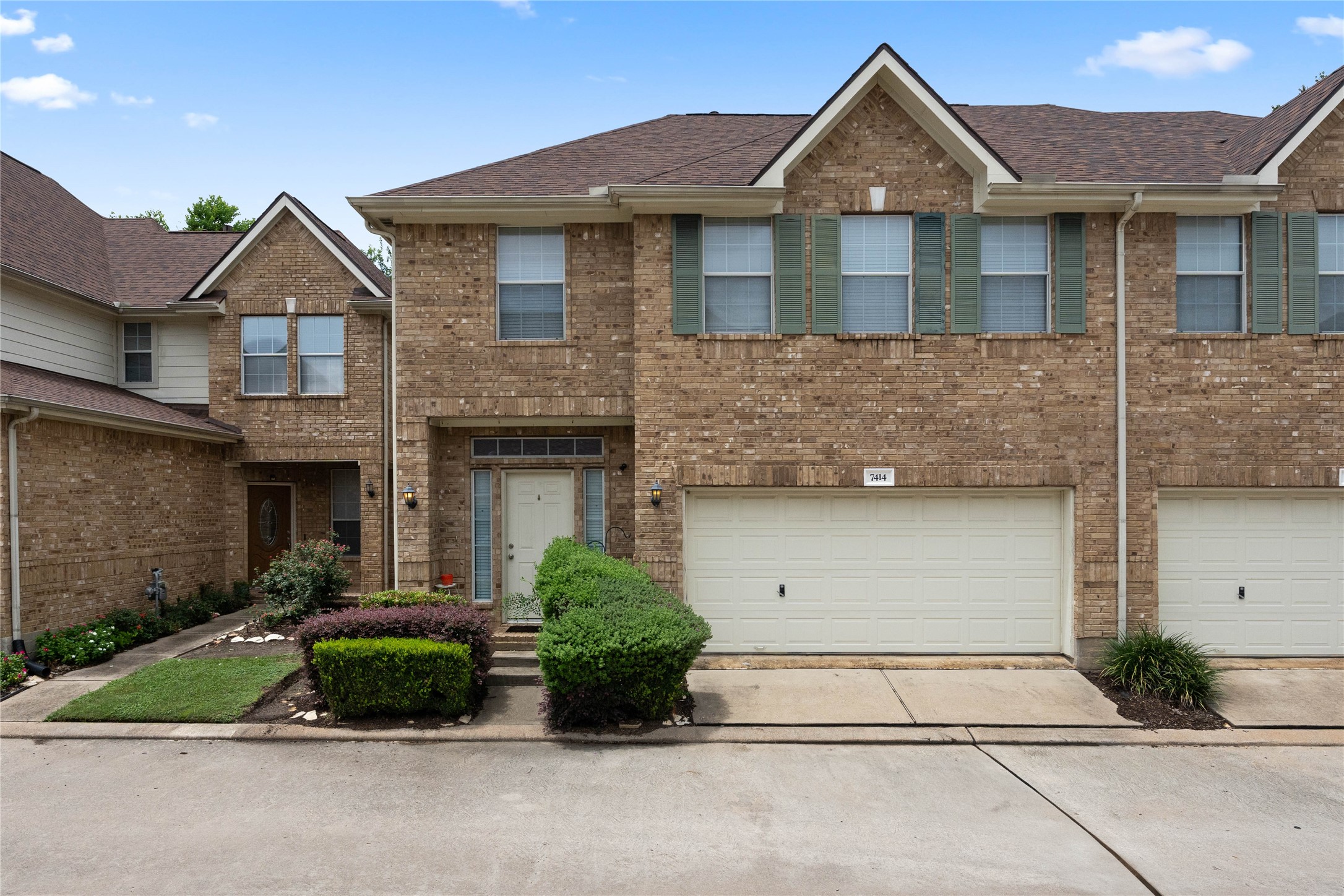 Discover your new home at 7414 Hollister Spring! This inviting townhouse features a charming brick exterior, spacious two-car garage, and well-maintained landscaping. Enjoy the perfect blend of comfort and convenience in a desirable neighborhood.