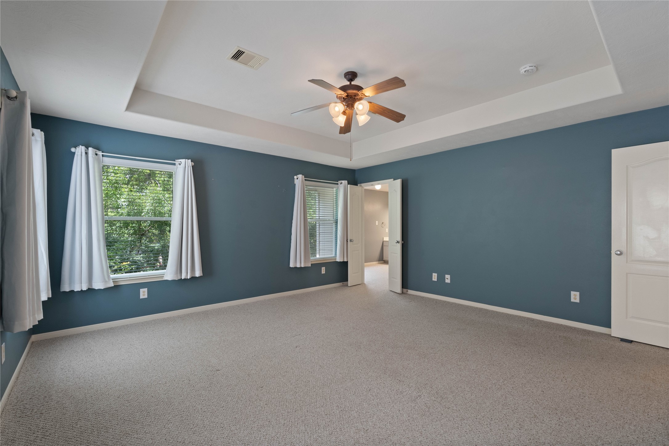 7414 Hollister Spring Houston, TX 77040 - Photo 16 of 26 Inviting primary bedroom with fresh paint, ready for your personal touch.