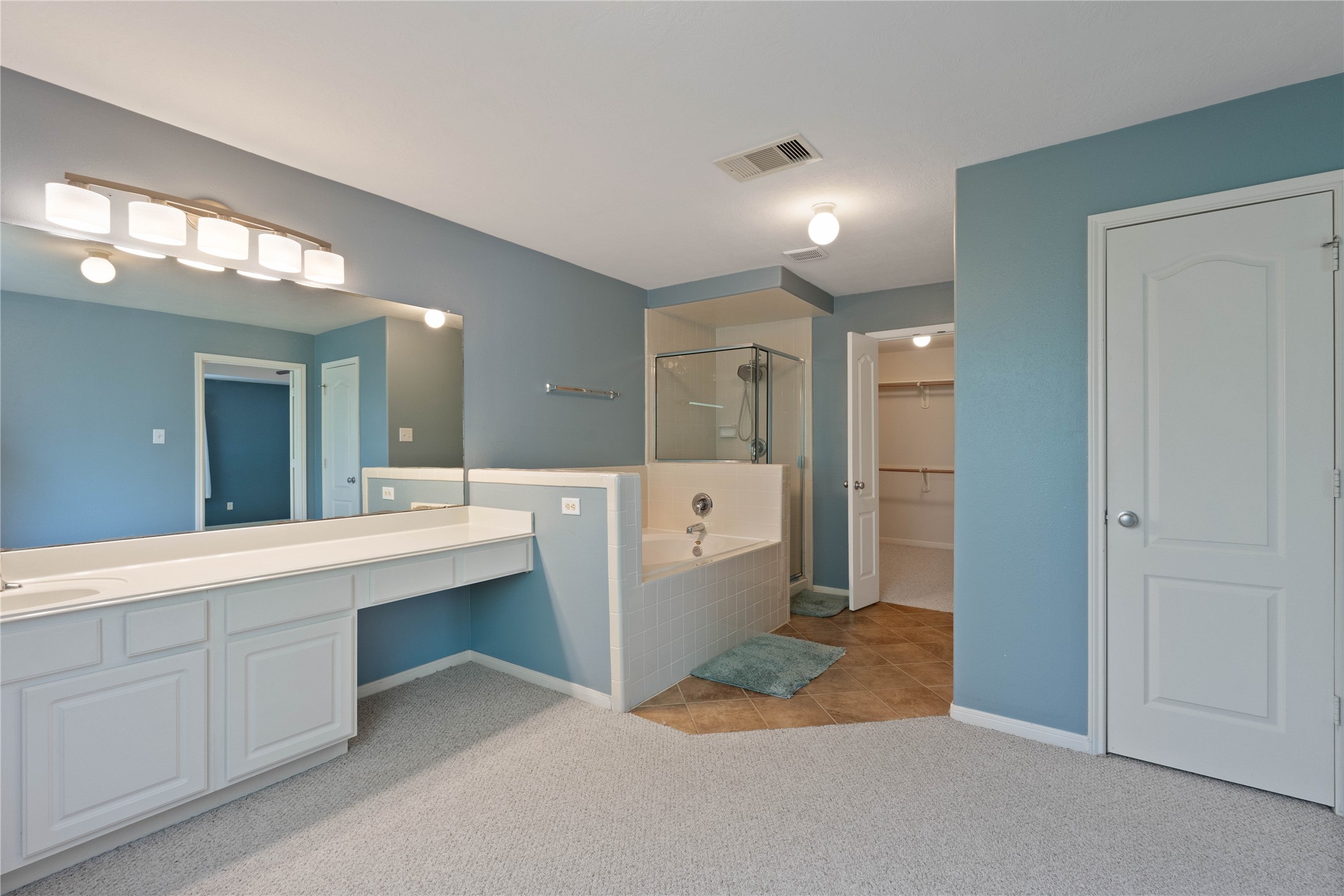 7414 Hollister Spring Houston, TX 77040 - Photo 17 of 26 Enjoy the convenience of a spacious walk-in closet directly accessible from the primary bath.