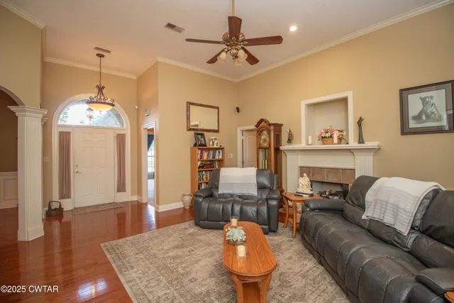 a living room with furniture and a fireplace