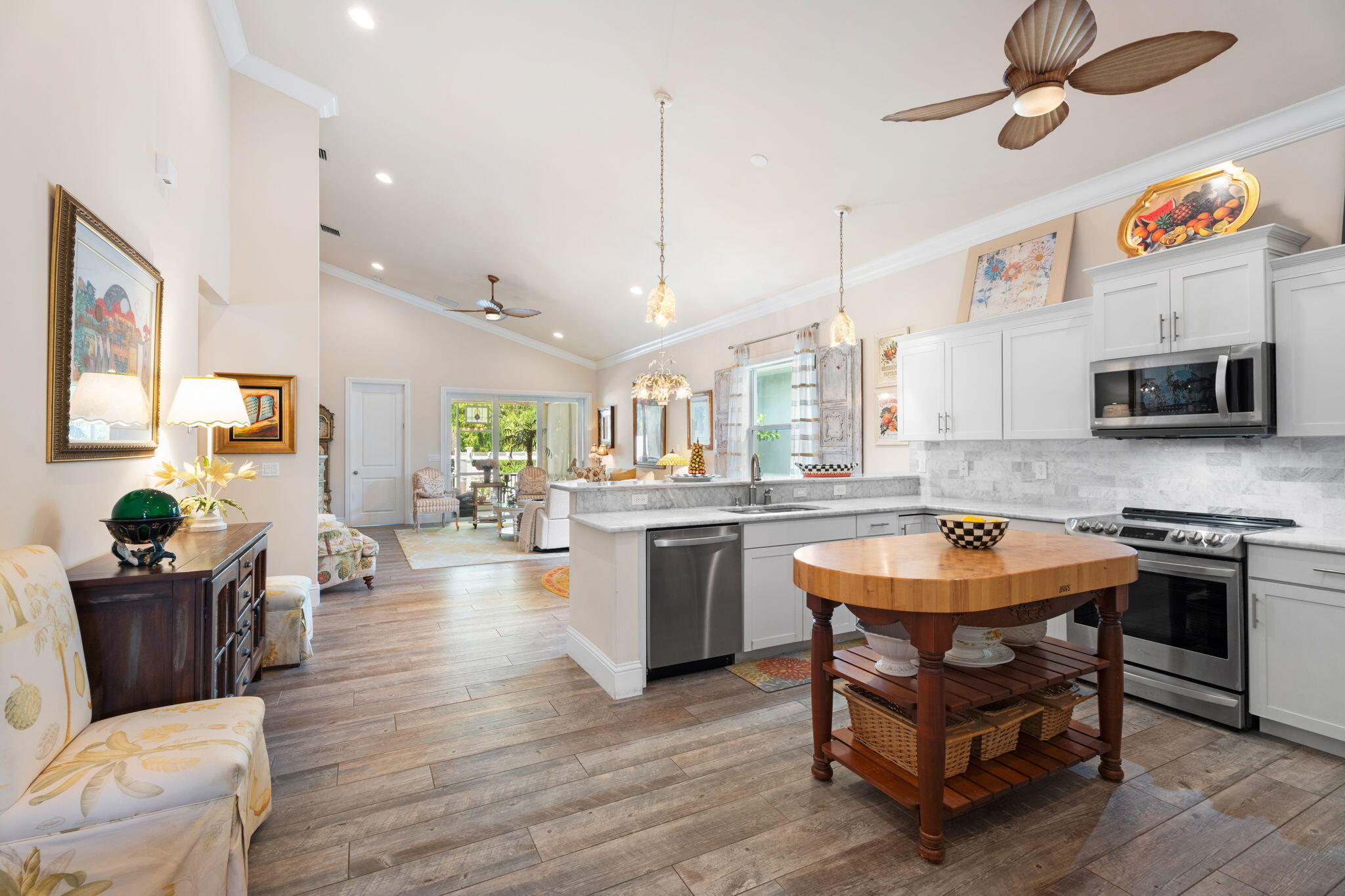 412 Southwest Akron Avenue Stuart, FL 34994 - Photo 12 of 60 a kitchen with stainless steel appliances granite countertop a stove and a wooden floors