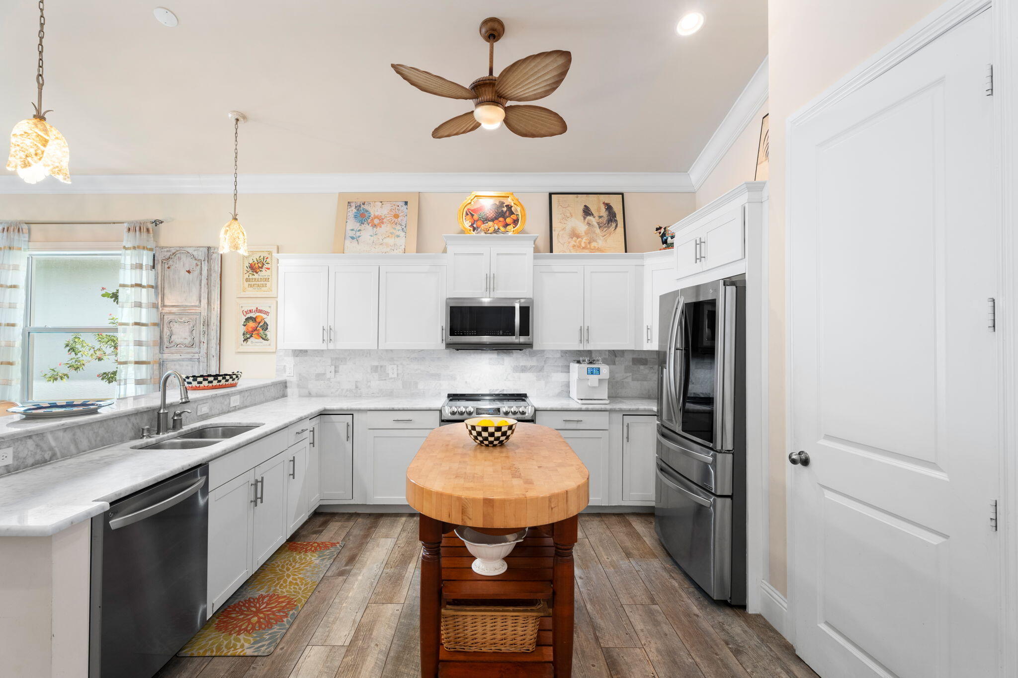412 Southwest Akron Avenue Stuart, FL 34994 - Photo 13 of 60 a kitchen with stainless steel appliances a sink stove and refrigerator