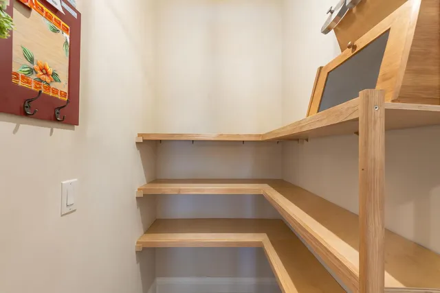 a living room with furniture dining table and a chandelier