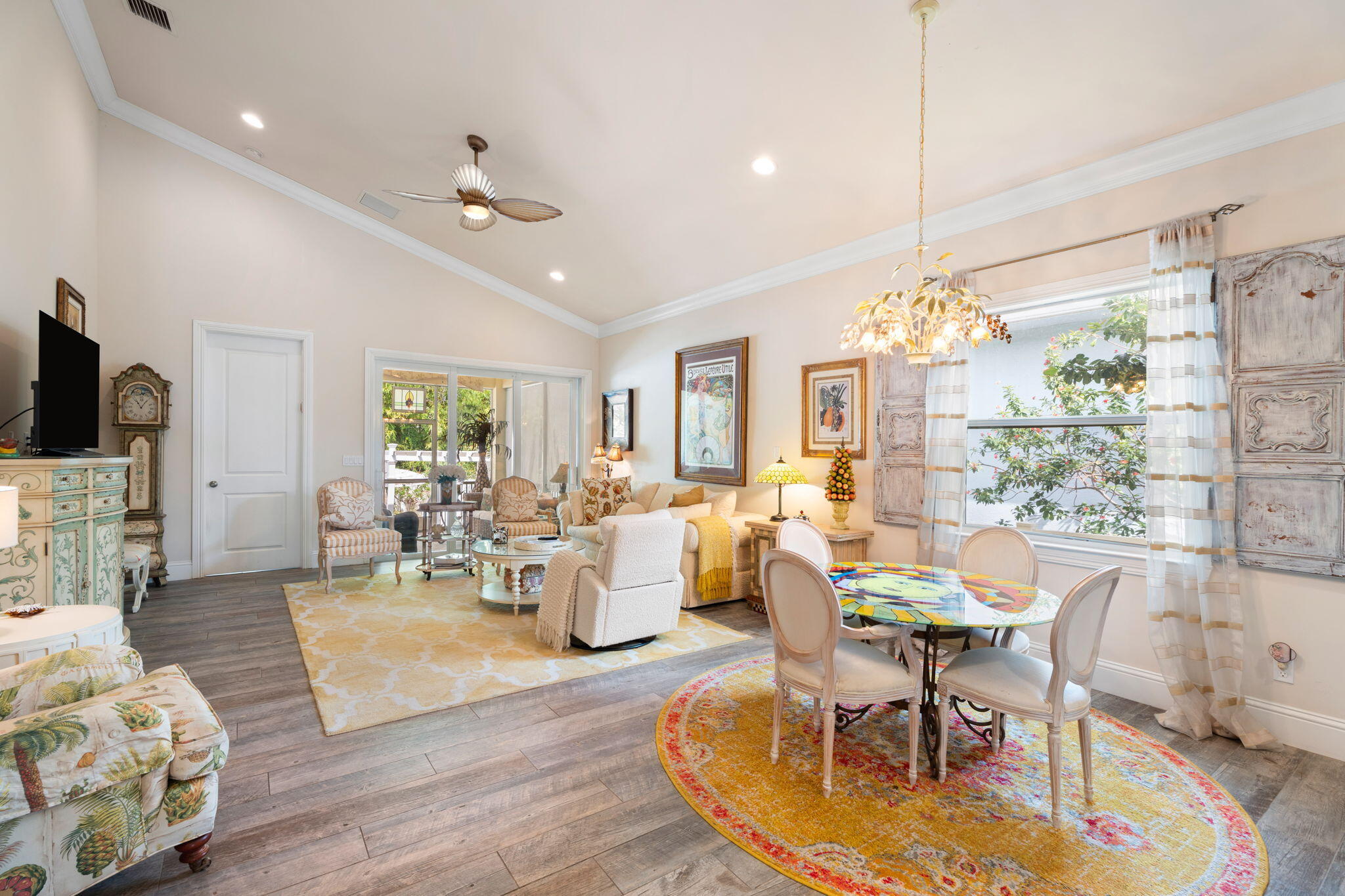412 Southwest Akron Avenue Stuart, FL 34994 - Photo 17 of 60 a living room with furniture dining table and a chandelier