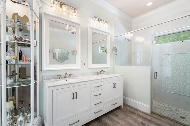 a bathroom with a granite countertop sink a toilet and shower curtain