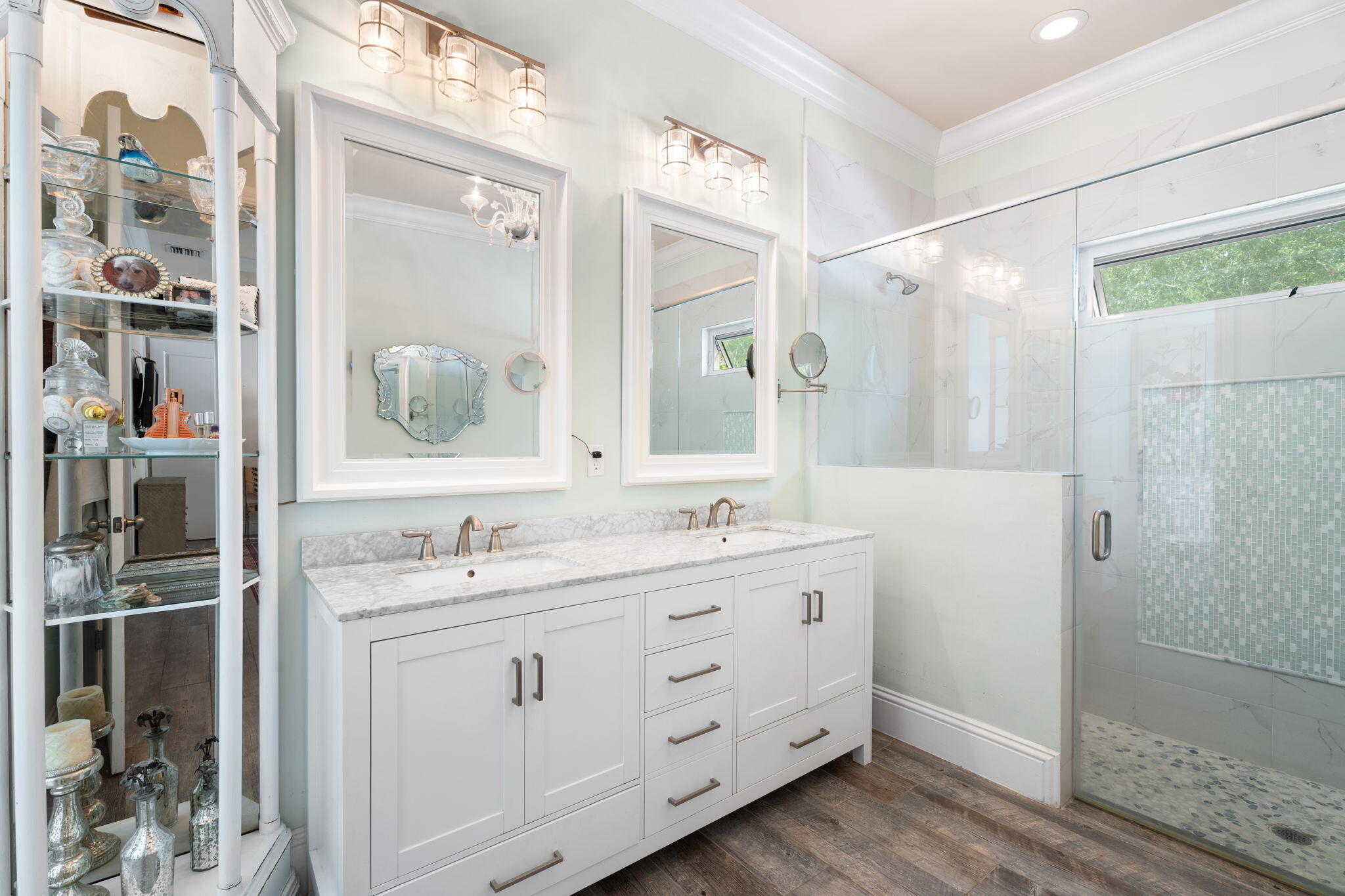412 Southwest Akron Avenue Stuart, FL 34994 - Photo 26 of 60 a spacious bathroom with a double vanity sink a mirror and shower