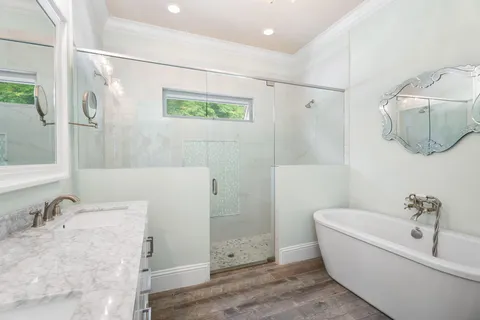 a view of a house with backyard porch and sitting area