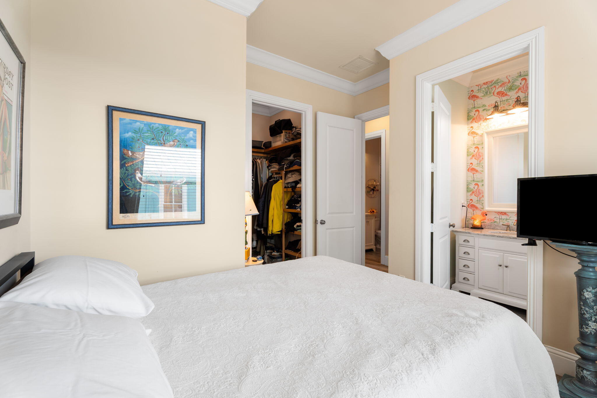 412 Southwest Akron Avenue Stuart, FL 34994 - Photo 28 of 60 a bedroom with a bed and a flat screen tv