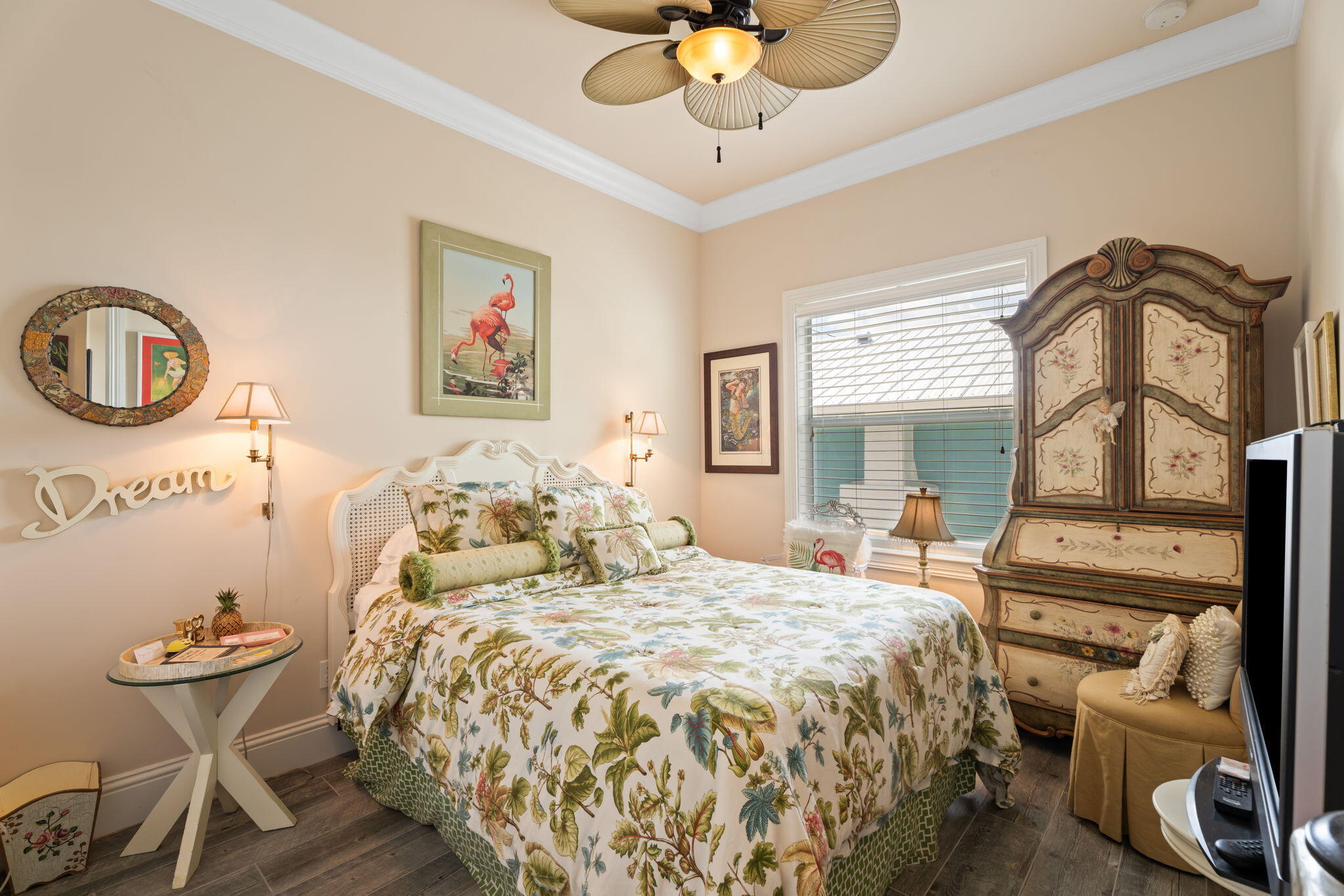 412 Southwest Akron Avenue Stuart, FL 34994 - Photo 31 of 60 a bedroom with a bed and a chandelier