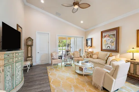 a view of a house with backyard and sitting area