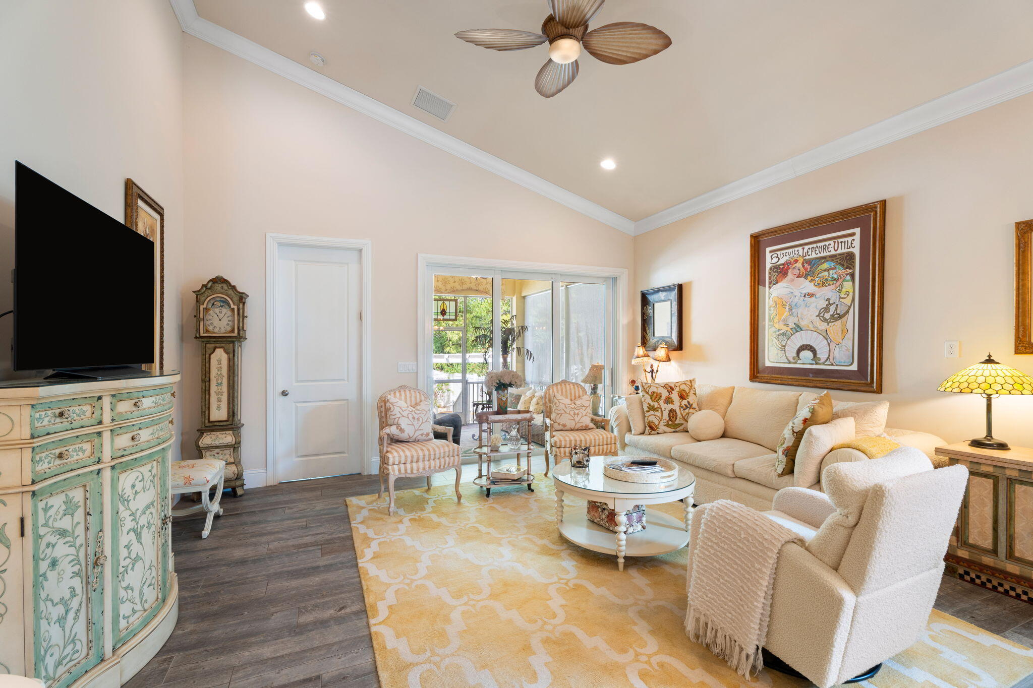 412 Southwest Akron Avenue Stuart, FL 34994 - Photo 36 of 60 a living room with furniture and a flat screen tv