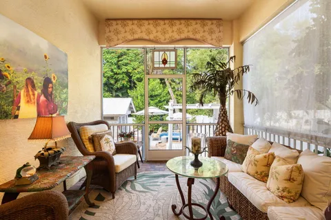 a view of a patio with swimming pool table and chairs