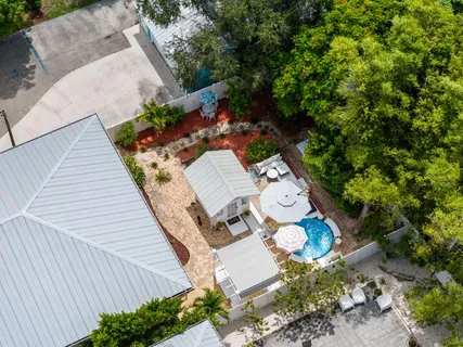 an outdoor sitting area with furniture and garden