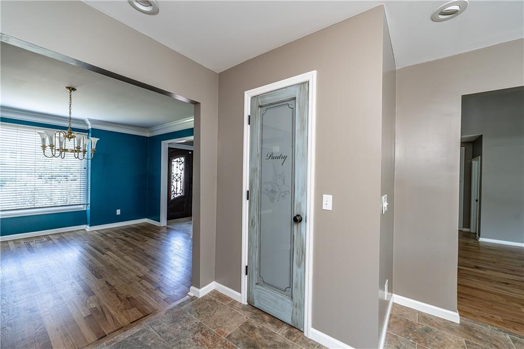 113 Warwick Way Rome, GA 30161 - Photo 17 of 49 a view of a hallway with wooden floor and a living room