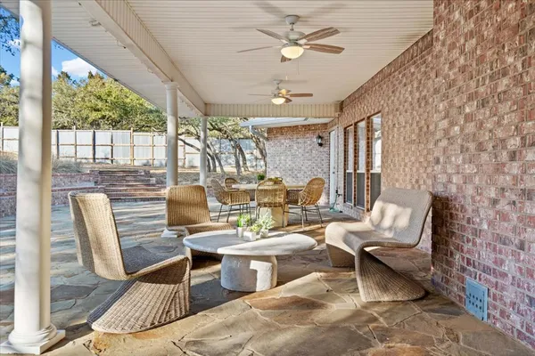 a living room with patio furniture