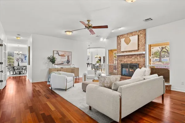 a living room with furniture and a fireplace