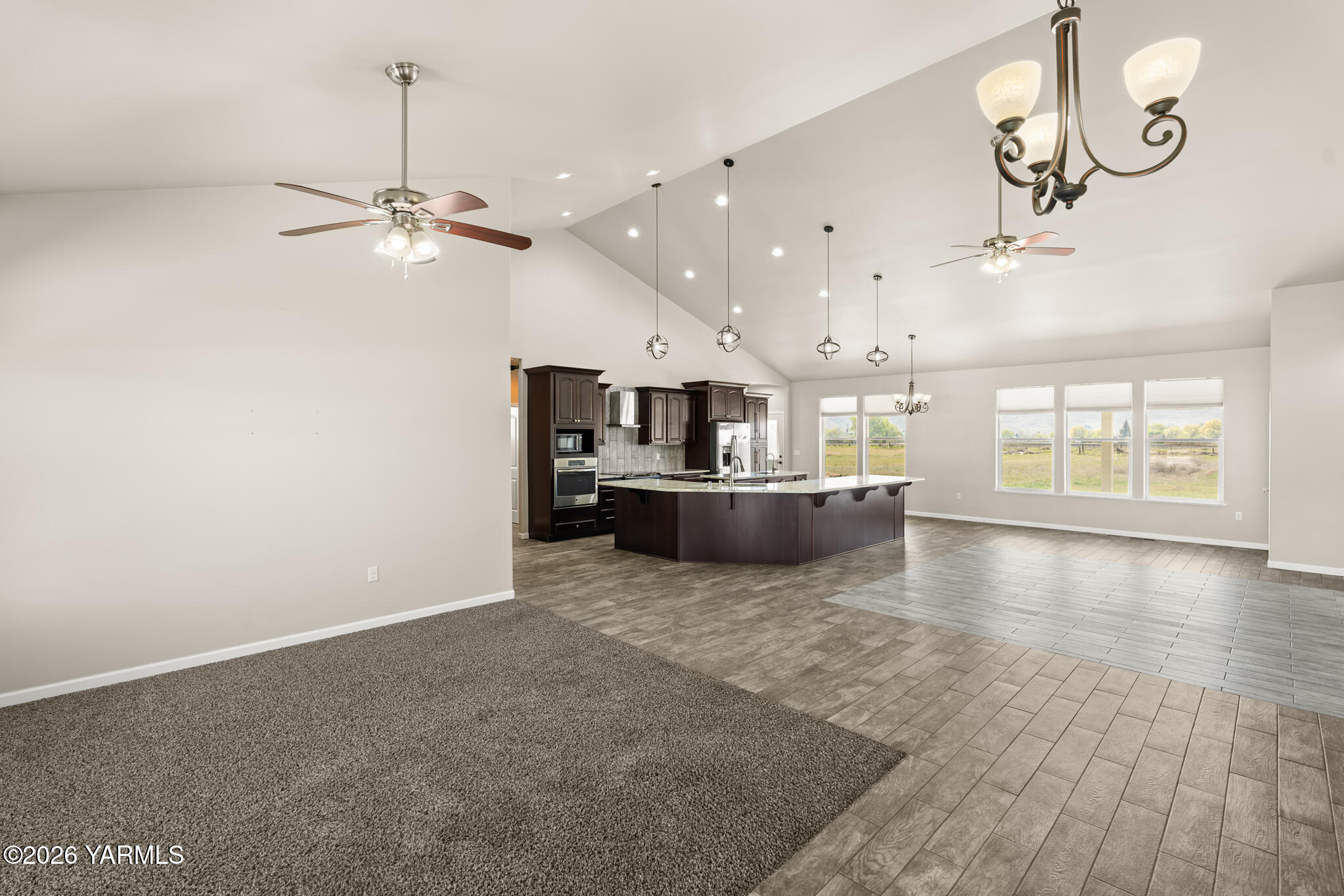 11625 Missimer Road Prosser, WA 99350 - Photo 9 of 40 a view of a kitchen with a sink and refrigerator