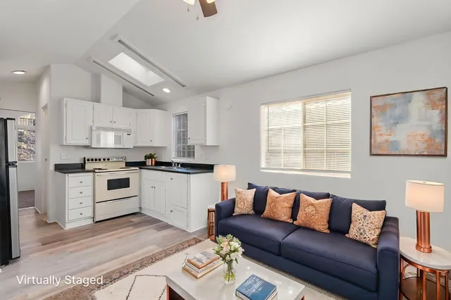 a kitchen with a white cabinets and white appliances