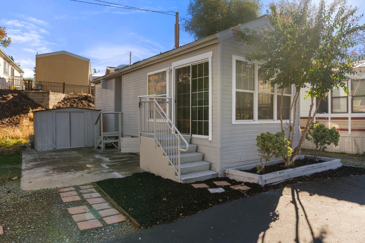 607 Mountain Ranch Road, Unit 5 San Andreas, CA 95249 - Photo 2 of 16 front view of a house with potted plants