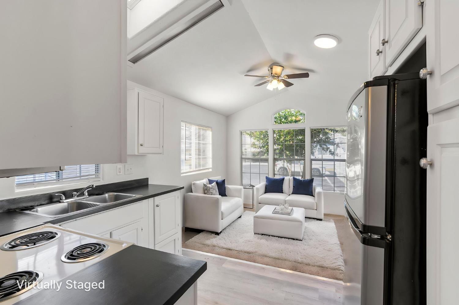 607 Mountain Ranch Road, Unit 5 San Andreas, CA 95249 - Photo 6 of 16 a living room with furniture appliances and a large window