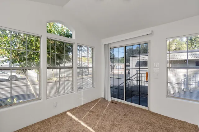 en empty room with windows