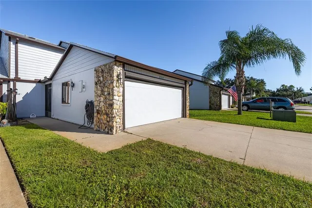 a front view of house with yard and green space