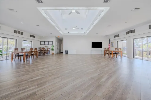 a view of dining room with furniture and wooden floor
